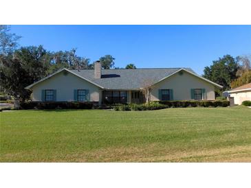 One-story home with green shutters and spacious lawn at 3282 Sw 9Th Ave, Ocala, FL 34471