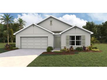 One-story home with a two-car garage and landscaped front yard at 9964 Se 161St Lane Rd, Summerfield, FL 34491