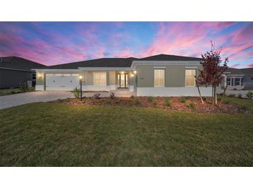 Single-story house with landscaped yard, two-car garage, and attractive exterior at 9757 Sw 79Th Lane Rd, Ocala, FL 34481