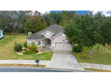 Single-story home with landscaped yard and two-car garage at 3803 Se 6Th Ave, Ocala, FL 34480