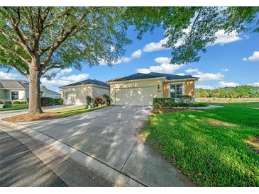 Charming two-story home with a two-car garage and landscaped yard at 9591 Sw 70Th Loop, Ocala, FL 34481