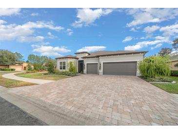 Charming two-story home with a three-car garage and paver driveway at 9175 Sw 65Th Loop, Ocala, FL 34481