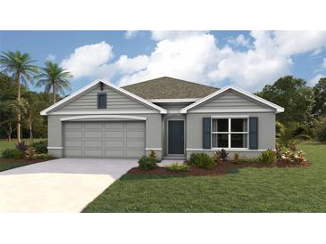 Exterior elevation of a single-story home with a gray facade, two-car garage, and landscaped yard at 7234 Se 113Th Ln, Belleview, FL 34420