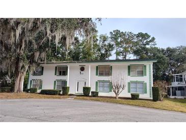 Two-story building with green accents and landscaping at 1570 Se 27Th St # H, Ocala, FL 34471