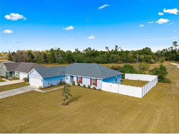 Newly built home with fenced backyard and spacious lot at 3321 Sw 153Rd Place Rd, Ocala, FL 34473