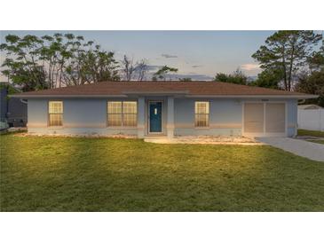 Charming one-story house with a well-maintained lawn at 11852 Se 71St Ct, Belleview, FL 34420
