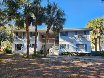 Inviting condo building with palm trees and landscaping at 8178 Fairways Cir # U201, Ocala, FL 34472