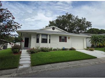 House exterior with landscaping and driveway at 3130 Prairie Dunes W Cir, Lakeland, FL 33810