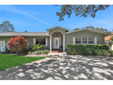 Charming single story home with a well-maintained front yard at 1441 S Lake Roy Dr, Winter Haven, FL 33884