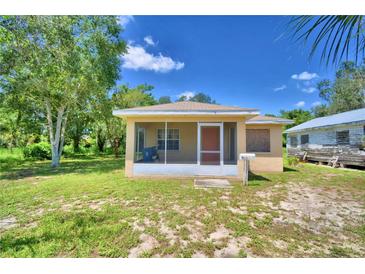 Charming one-story home with a screened porch at 317 C St, Lake Wales, FL 33853