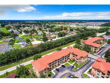 Aerial view of community featuring various housing styles and landscape at 902 Charo Pkwy # 624, Davenport, FL 33897