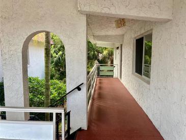 Exterior view of the building showing balcony at 1100 Martinique Dr # 208, Winter Haven, FL 33884