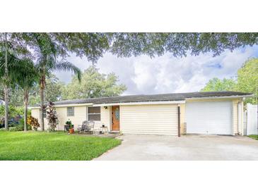 Single story home with attached garage and spacious yard at 4822 Melody Ln, Lakeland, FL 33805