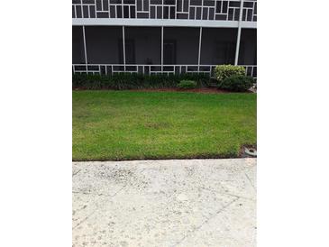 Well-maintained lawn in front of building at 1700 6Th Nw St # C7, Winter Haven, FL 33881
