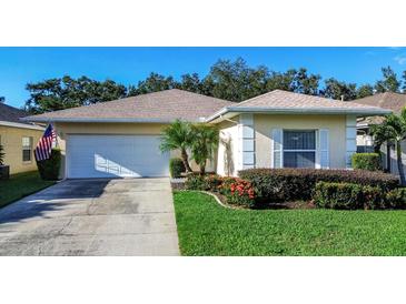 Charming single-story home with a well-manicured lawn at 708 Canberra Rd, Winter Haven, FL 33884