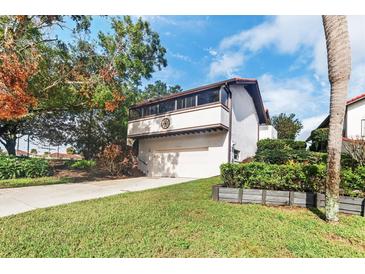 Two-story home with attached garage at 6001 Country Club Dr, Lake Wales, FL 33898