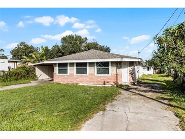 Brick house with a well-maintained lawn and driveway at 6426 Jenny Dr, Lake Wales, FL 33898