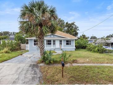 Charming bungalow with gray siding, and palm tree at 1800 4Th Nw St, Winter Haven, FL 33881
