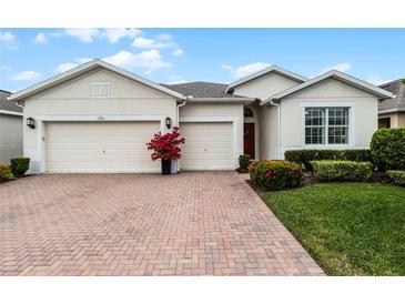 Attractive single-story home with a two-car garage and landscaped front yard at 3659 Plymouth Dr, Winter Haven, FL 33884