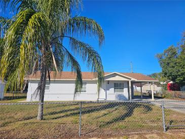 Newly renovated home with a fenced yard and carport at 2349 Lisa St, Lake Wales, FL 33898
