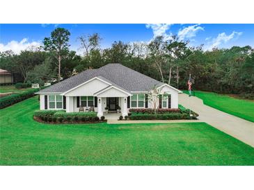 Beautiful home with a large yard and driveway at 2997 Sequoyah Dr, Haines City, FL 33844