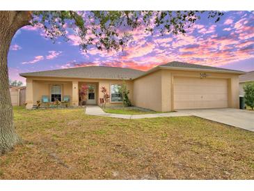 One-story house with attached garage and landscaped yard at 1490 Meadows Pond Dr, Bartow, FL 33830