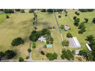 Aerial view of house and expansive property at 8375 Ne Jacksonville Rd, Ocala, FL 34479