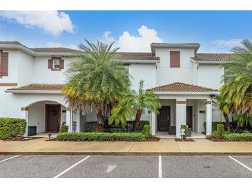 Two-story townhome with attractive landscaping and a covered entry at 3148 Pequod Pl, Kissimmee, FL 34746