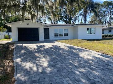 Charming ranch home with a paver driveway at 1204 Lake Elbert Se Dr, Winter Haven, FL 33880