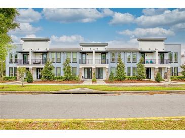 Modern three-unit building with balconies at 1680 Houston St, Kissimmee, FL 34743