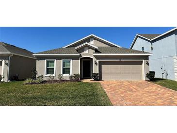 One-story house with a neutral color scheme at 1580 Wynell St, St Cloud, FL 34771
