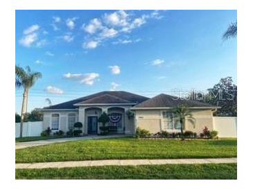 House exterior showcasing a two-story home with a landscaped yard at 7953 Sea Pearl Cir, Kissimmee, FL 34747