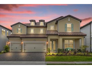 Two-story house with three car garage and landscaped yard at 7650 Wandering Way, Orlando, FL 32836