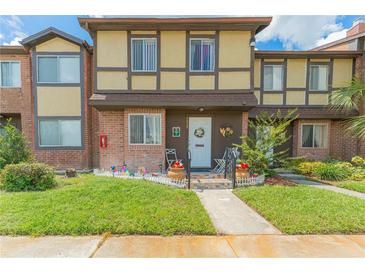 Attractive townhome with landscaping and walkway at 5038 Downing St # 7, Orlando, FL 32839