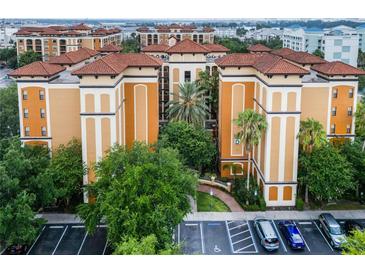Aerial view of a building with several units and parking at 12539 Floridays Resort Dr # 305-D, Orlando, FL 32821
