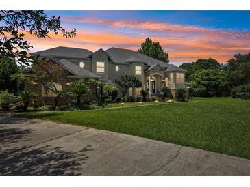 Stunning two-story home with a landscaped yard and driveway at 9502 Hempel Cove Blvd, Windermere, FL 34786