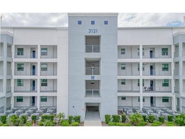 Modern building exterior with multiple balconies at 3121 Paradox Circle 207 # 207, Kissimmee, FL 34746