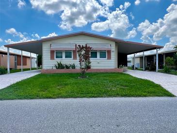 Quaint single-wide manufactured home with carport at 5013 Foxwood Blvd, Lakeland, FL 33810