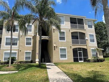 Three-story apartment building with screened balconies at 2305 Silver Palm Dr # 302, Kissimmee, FL 34747