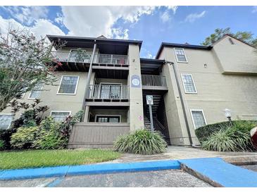 Condo building exterior with balconies and landscaping at 249 Afton Sq # 303, Altamonte Springs, FL 32714