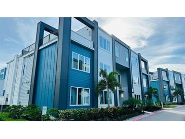 Modern building exterior with blue and white accents at 7740 Sandy Ridge Dr # 226, Kissimmee, FL 34747