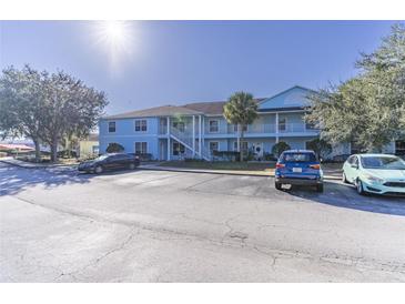 Front view of a light blue two-story building with parking in front at 3107 Sun Lake Ct # B, Kissimmee, FL 34747