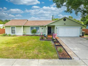 Light green house with two car garage at 961 Whisler Ct, Saint Cloud, FL 34769