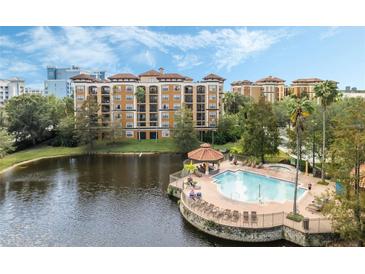 Aerial view of resort-style pool and building at 12538 Floridays Resort Dr # C-211, Orlando, FL 32821