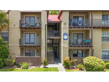 Two-story apartment building with multiple balconies and stairs at 232 Afton Sq # 108, Altamonte Springs, FL 32714