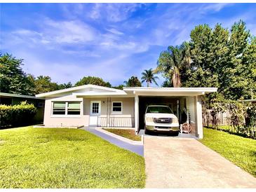 Single-story home with attached carport and a spacious yard at 316 Pennsylvania Ave, Saint Cloud, FL 34769