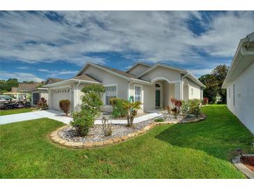 Attractive curb appeal with landscaping and walkway at 405 High Vista Dr, Davenport, FL 33837