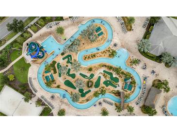 Aerial view of lazy river, pool, and mini golf at 4721 Clock Tower Dr # 302, Kissimmee, FL 34746
