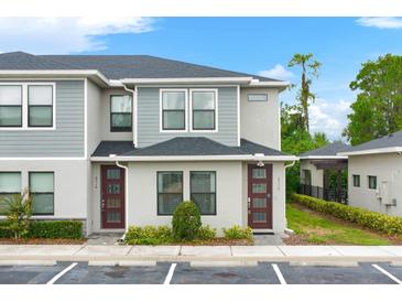 Two-story townhome with modern exterior and private entrance at 4716 Terra Esmeralda Dr, Kissimmee, FL 34746