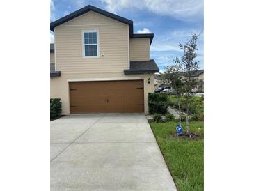 Two-story townhome with attached garage at 1523 Wynford Cir, Tavares, FL 32778
